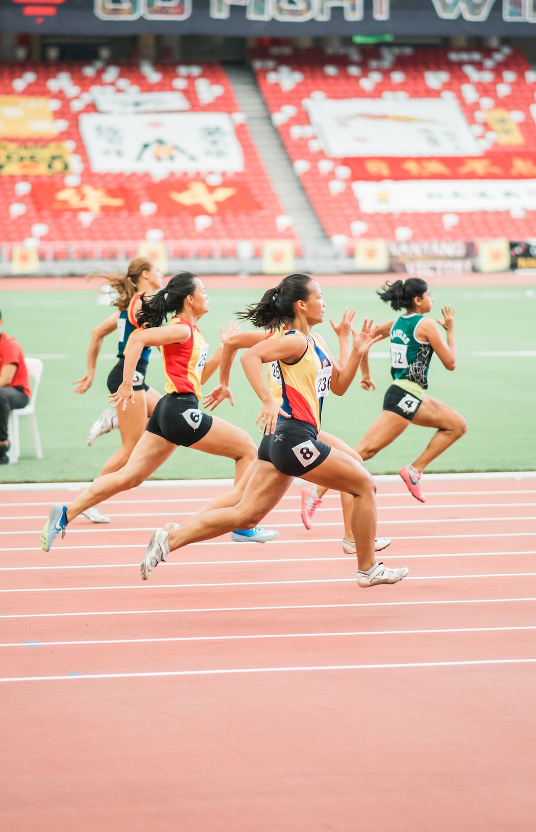 Old navy activewear by Athletic Brands women running on track field