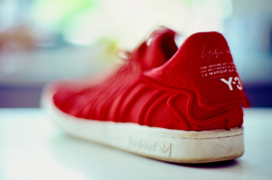 a close up of a red adidas sneaker