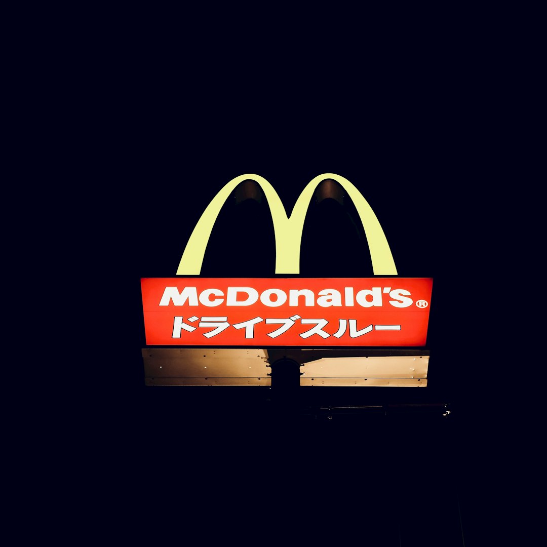 FAQ by Athletic Brands a mcdonald's restaurant sign lit up at night