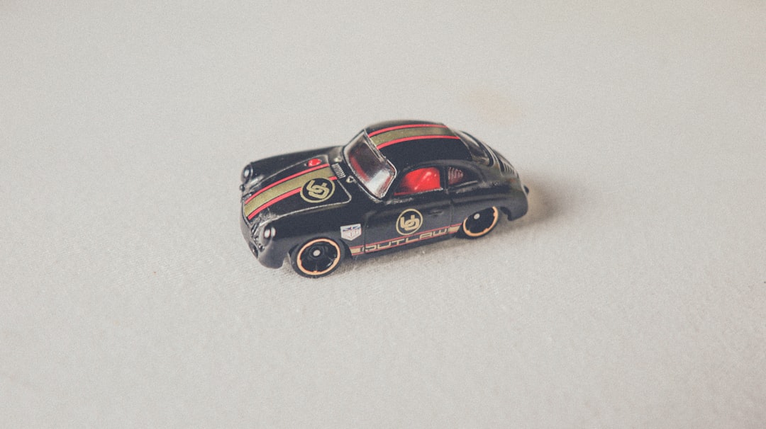 What are the Big 4 sports brands? by Athletic Brands a black toy car sitting on top of a white surface