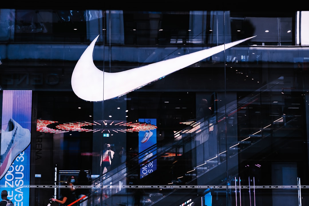 FAQ: Your Burning Questions About Athletic Apparel Giants Answered 🔥 by Athletic Brands white and black glass building